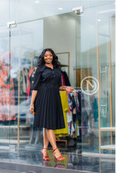 Chic black pleated skater dress